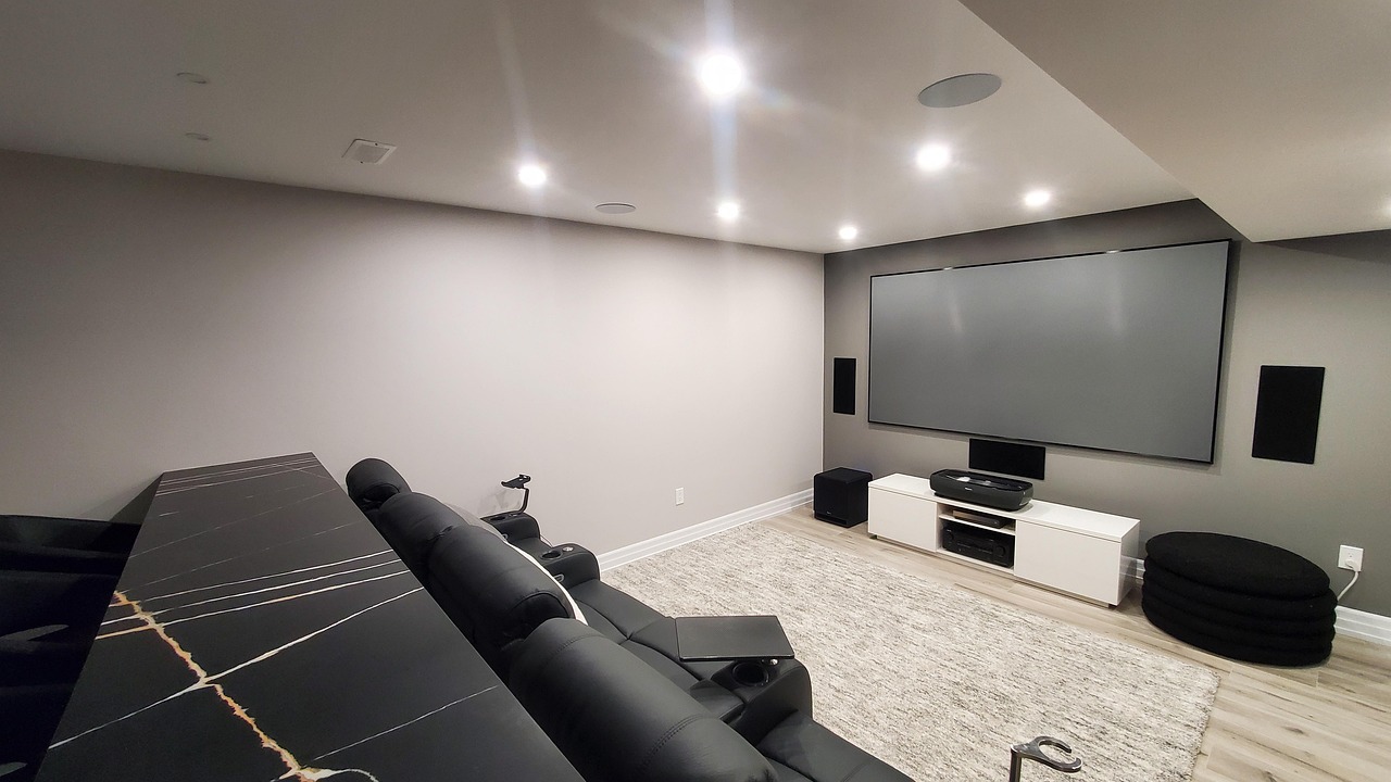 Modern basement home theater with projection screen, comfortable seating, and premium finishes in Richmond, Virginia
