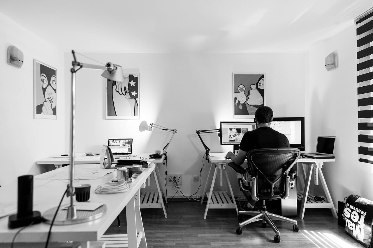 Sleek monochromatic office workspace with ergonomic furniture and contemporary design in Richmond, Virginia